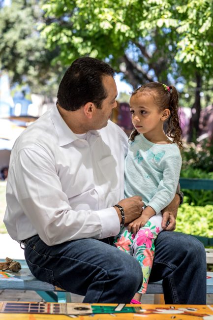 Parent talking with child.